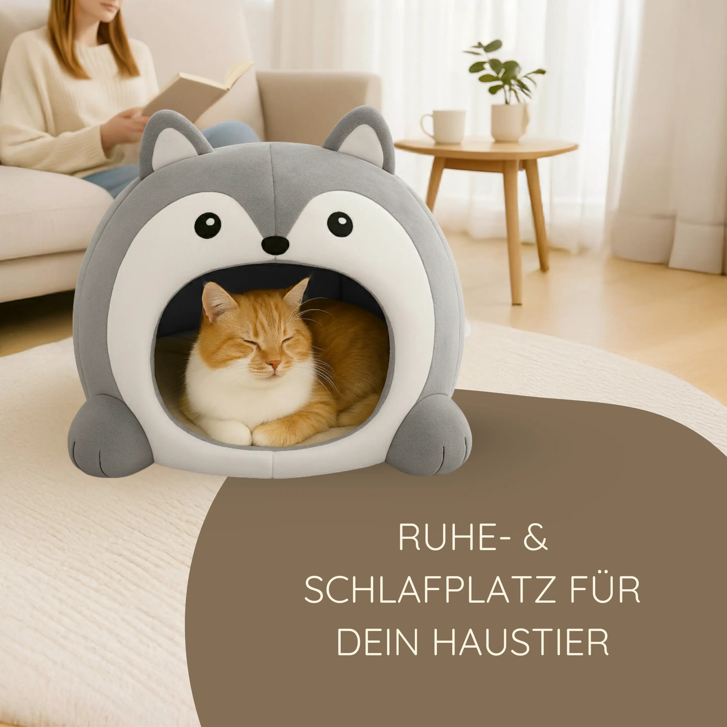 Das Bild zeigt die TATZIO Katzenhöhle Cozy in der Farbe Grau. In der Katzenhöhle liegt eine Katze und genießt den Ruheplatz.